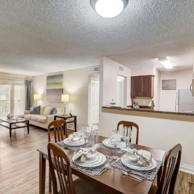 Large apartment living space with a dining area at Willowbrooke Apartments in Lakeland, FL
