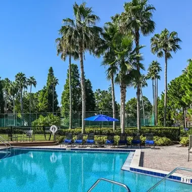 Resort-style pool and sundeck at Willowbrooke Apartments in Lakeland, FL